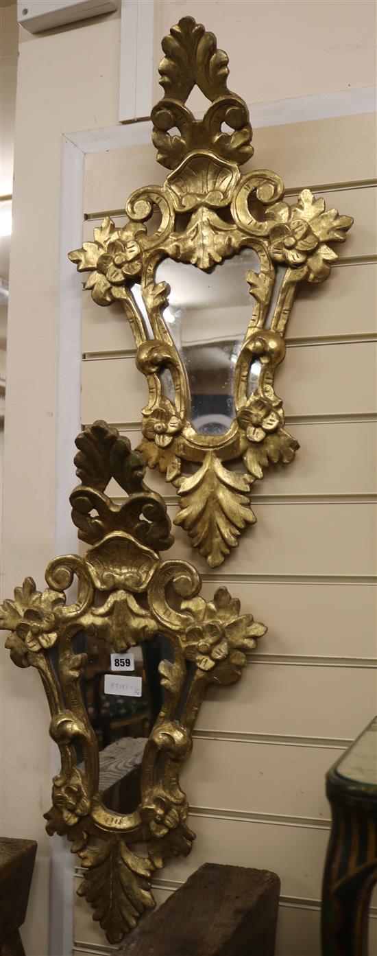 A pair of Italian giltwood cartouche-shaped wall mirrors W.39cm